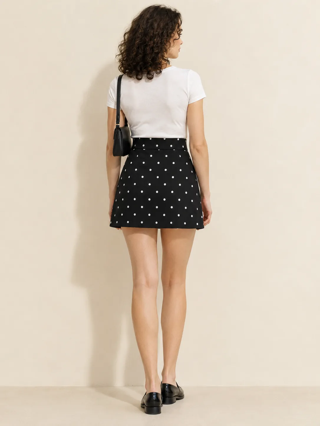 Arc Hem Mini Skirt, from the back