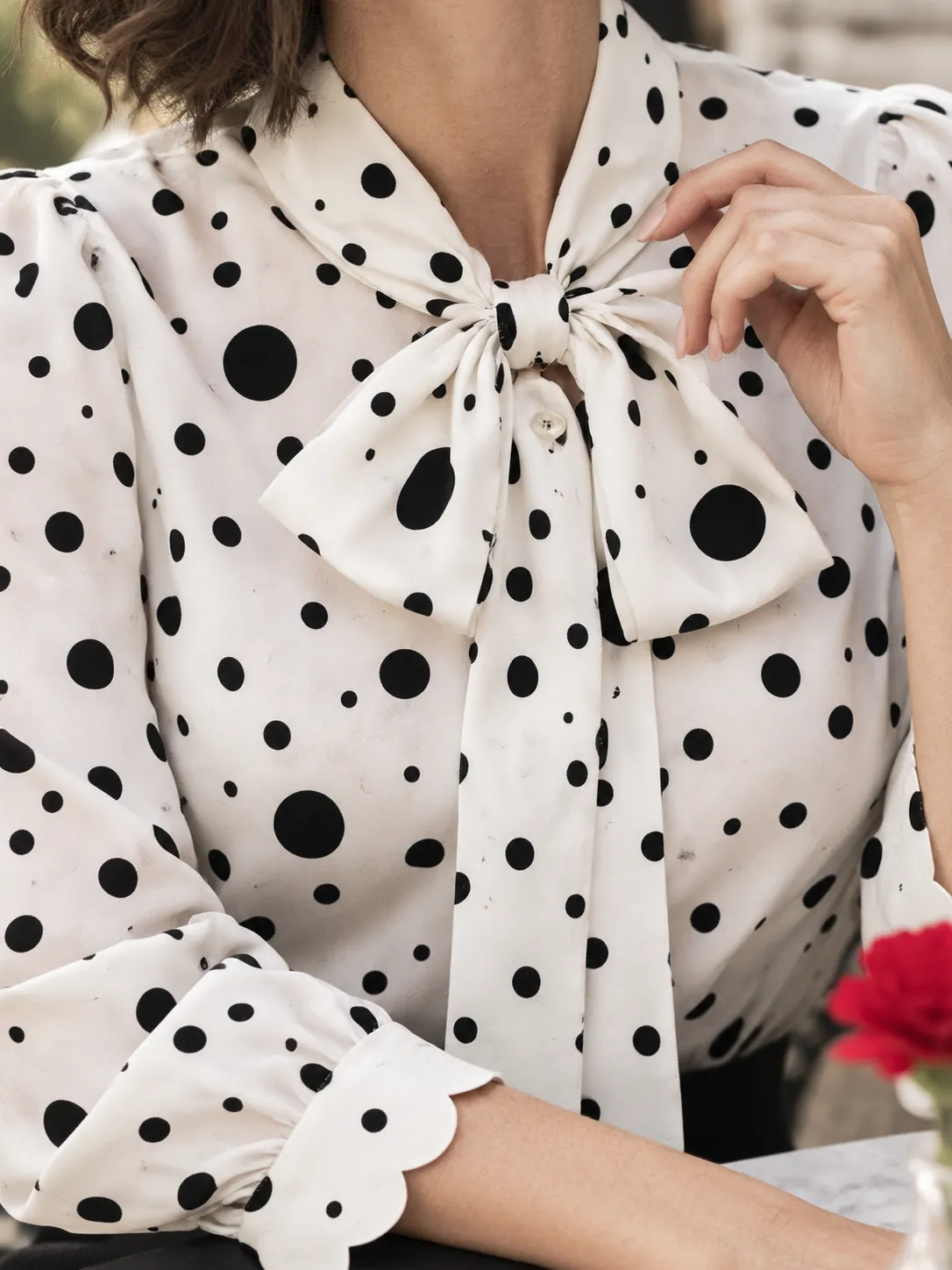 Bow Tie Scallop Blouse, close-up: the scalloped cuff and bow