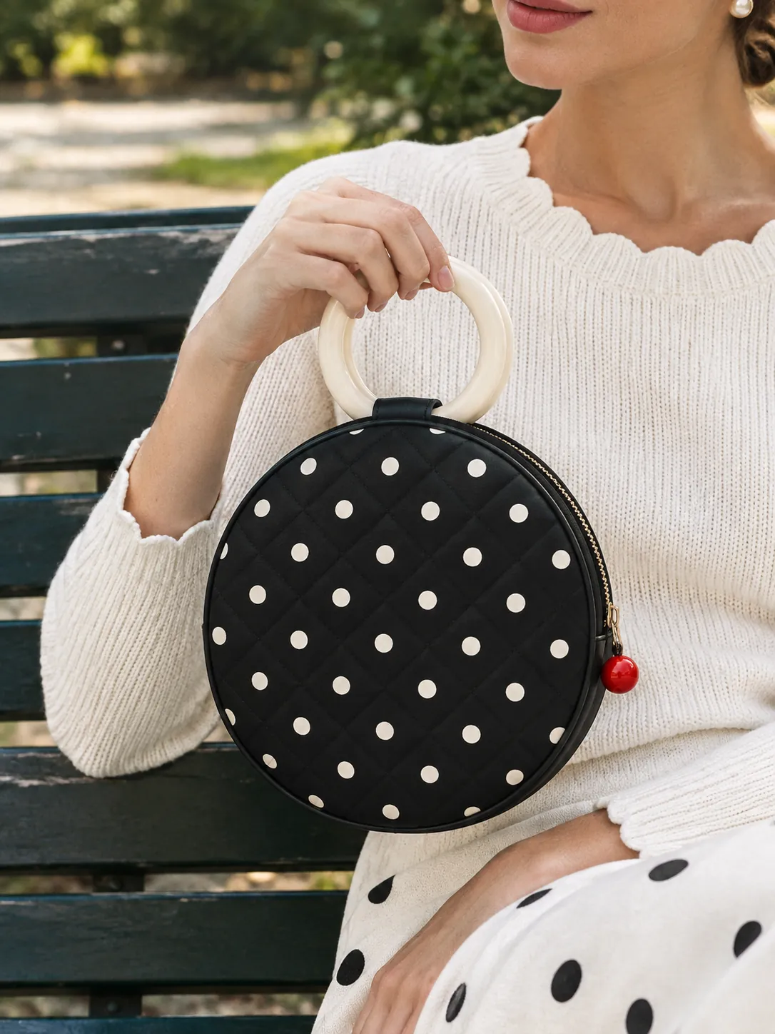 Circle Ring Bag in ink with milk dots, in use