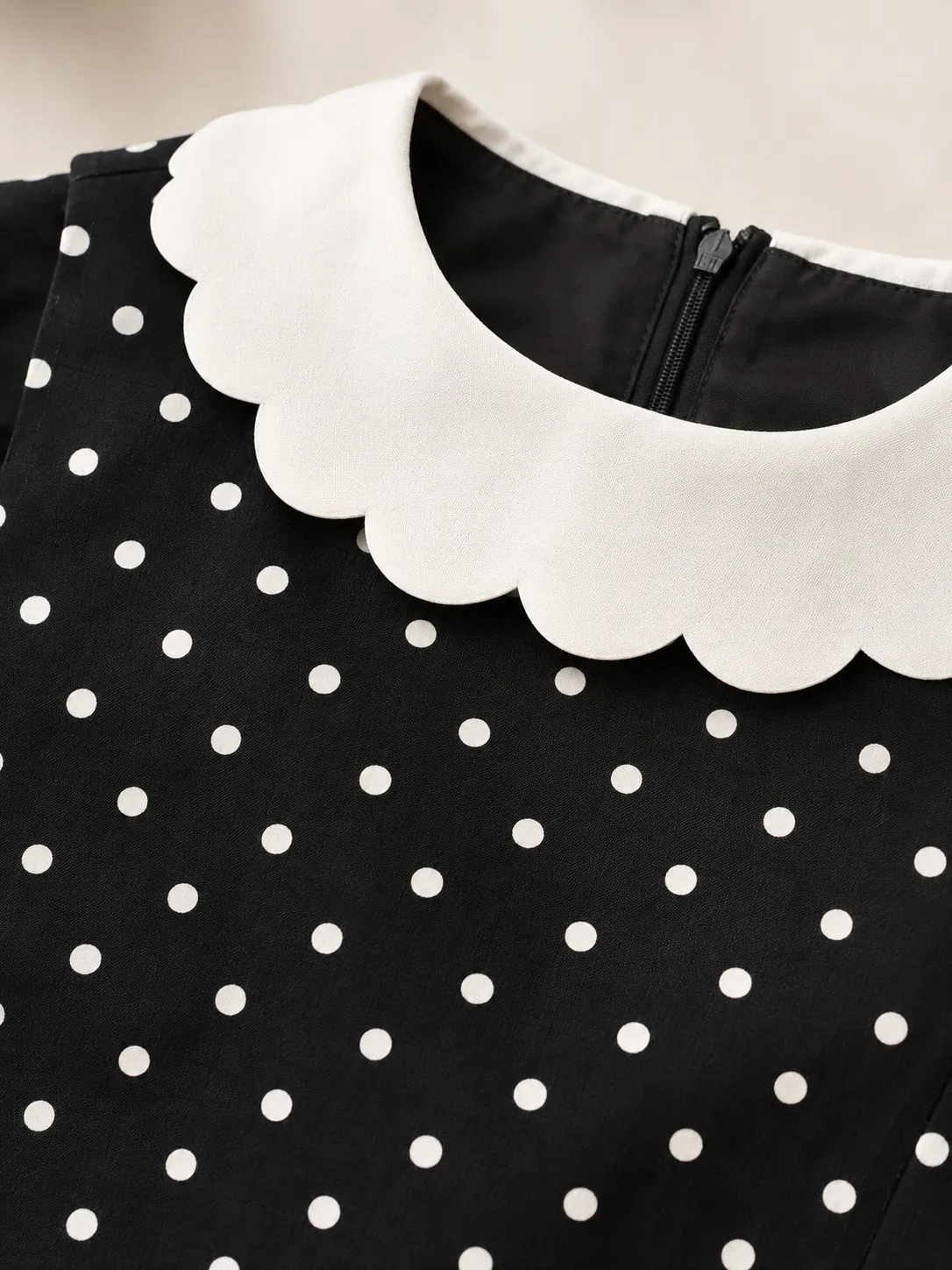 Round Collar Shell Top, close-up: the white scalloped round collar