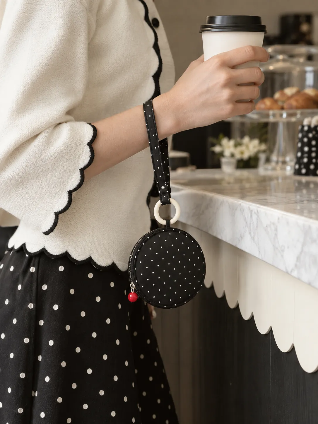 Round Pocket Pouch in ink with milk dots, in use