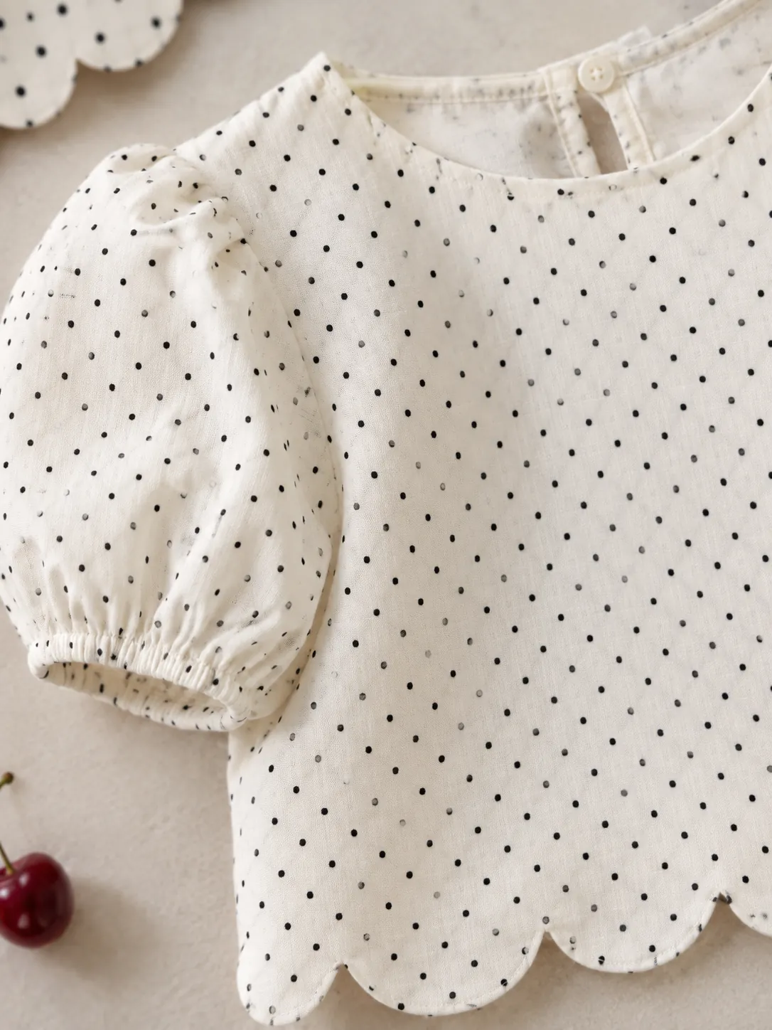 Scallop Hem Crop Blouse, close-up: the scalloped hem and pin dots