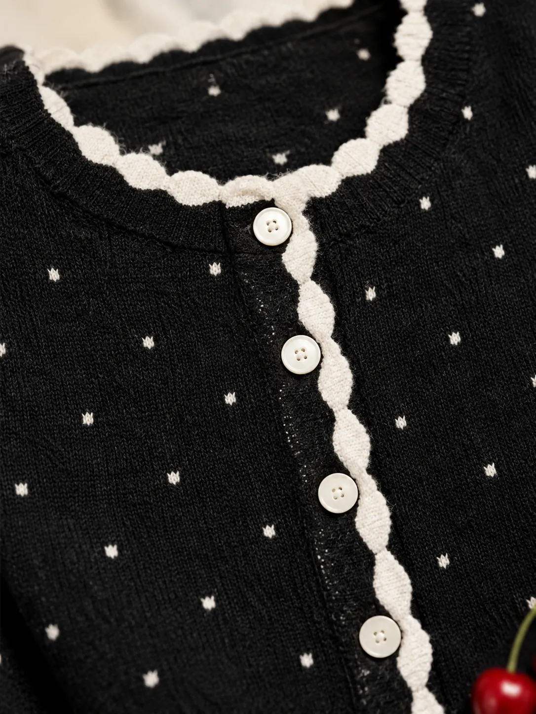 Scallop Trim Knit Cardigan, close-up: the white scalloped front edge and round buttons