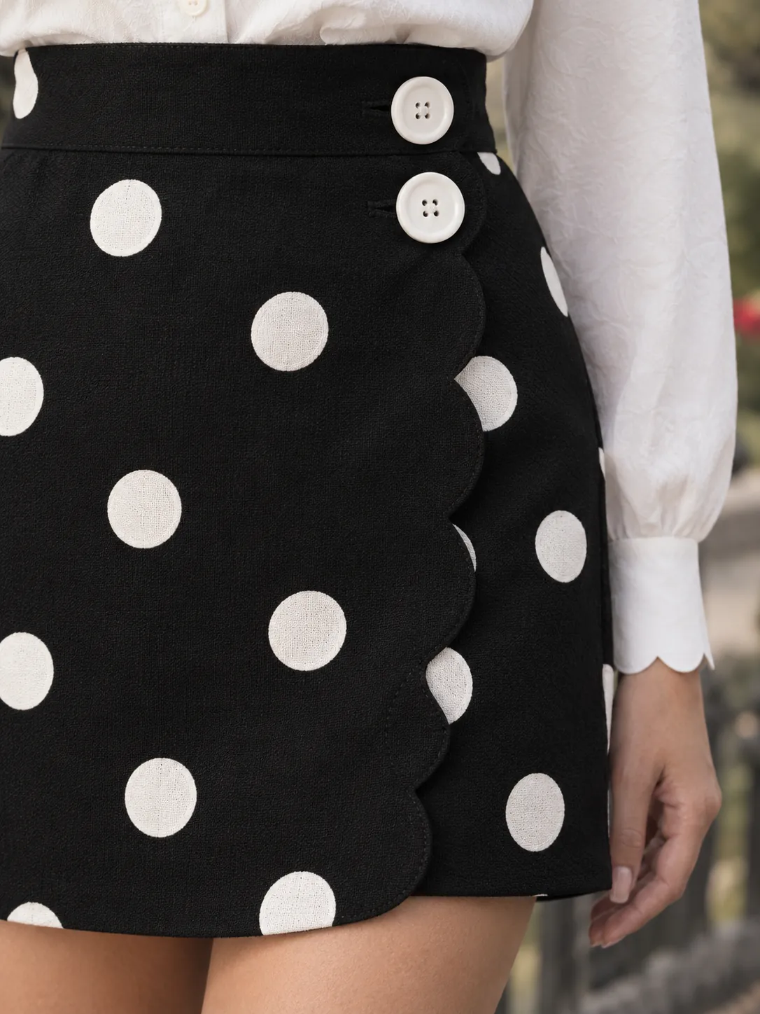 Side Flap Wrap Skirt, close-up: the rounded flap and round buttons