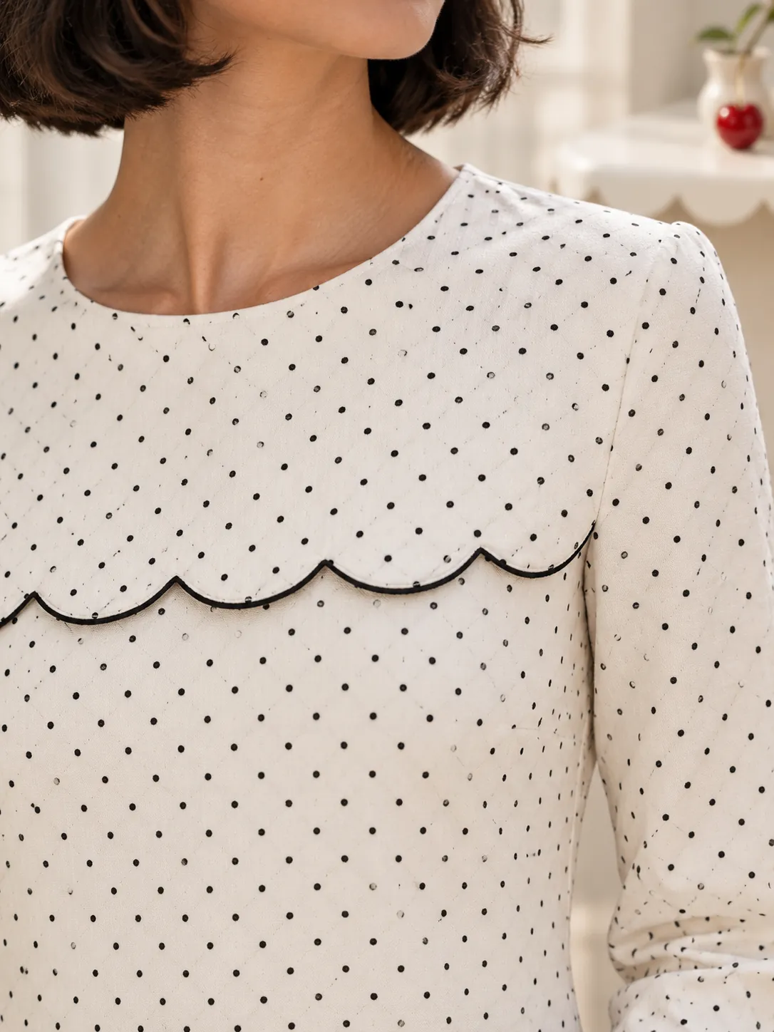 Tram Stop Shift Dress, close-up: the scalloped yoke seam and the pin-dot print
